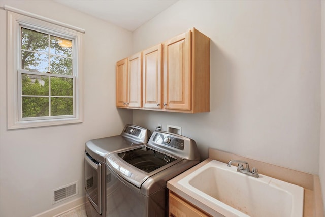 45055 Walnut Rdg, Northville, MI 48168 - washroom featuring washing machine and dryer, cabinet space, and baseboards