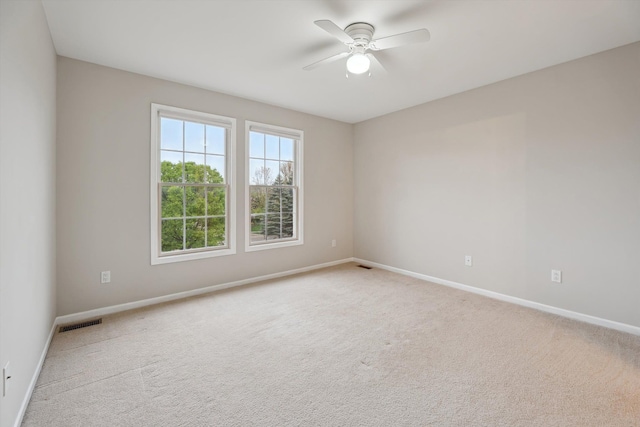 45055 Walnut Rdg, Northville, MI 48168 - unfurnished room with baseboards, a ceiling fan, and light colored carpet