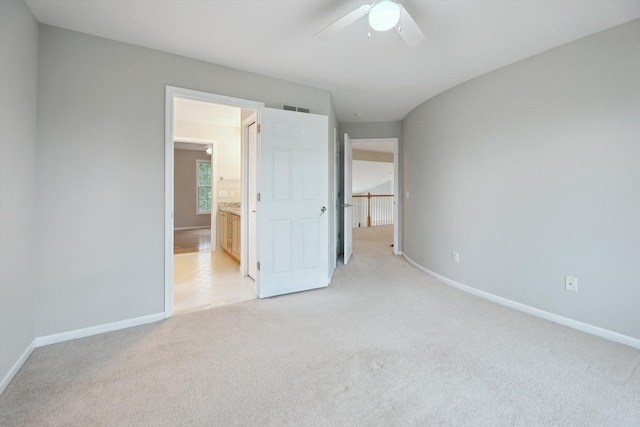 45055 Walnut Rdg, Northville, MI 48168 - unfurnished bedroom featuring light colored carpet, baseboards, connected bathroom, and a ceiling fan