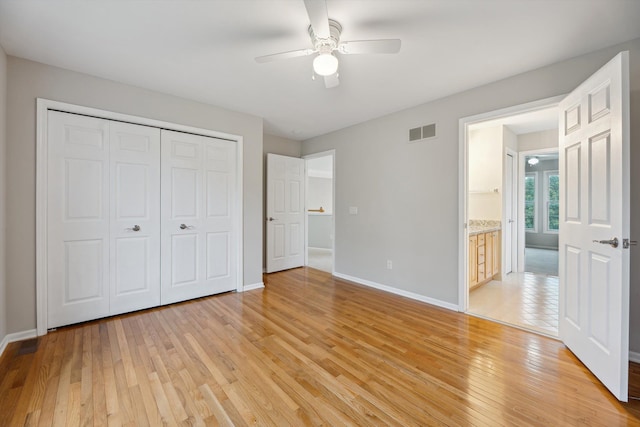 45055 Walnut Rdg, Northville, MI 48168 - unfurnished bedroom with light wood-style flooring, baseboards, a closet, and a ceiling fan