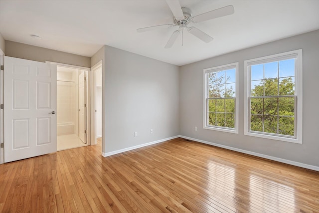 45055 Walnut Rdg, Northville, MI 48168 - unfurnished bedroom featuring baseboards, light wood-style floors, and ceiling fan