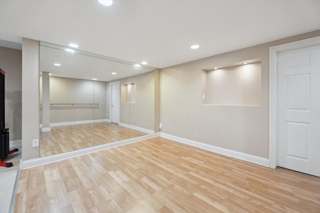 45055 Walnut Rdg, Northville, MI 48168 - finished below grade area featuring wood finished floors, baseboards, and recessed lighting