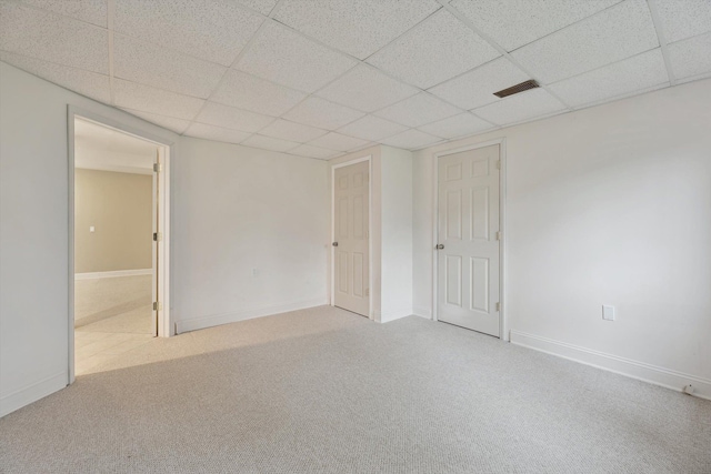 45055 Walnut Rdg, Northville, MI 48168 - empty room featuring a drop ceiling, carpet, and baseboards