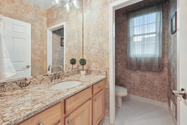 45055 Walnut Rdg, Northville, MI 48168 - bathroom featuring toilet, tile patterned flooring, vanity, and baseboards