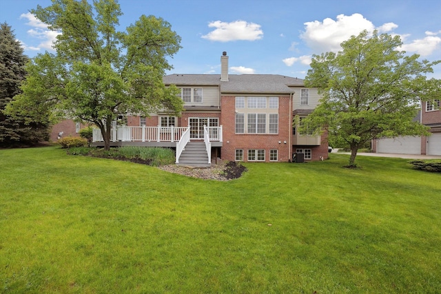 45055 Walnut Rdg, Northville, MI 48168 - rear view of house featuring brick siding, a yard, a deck, and a chimney