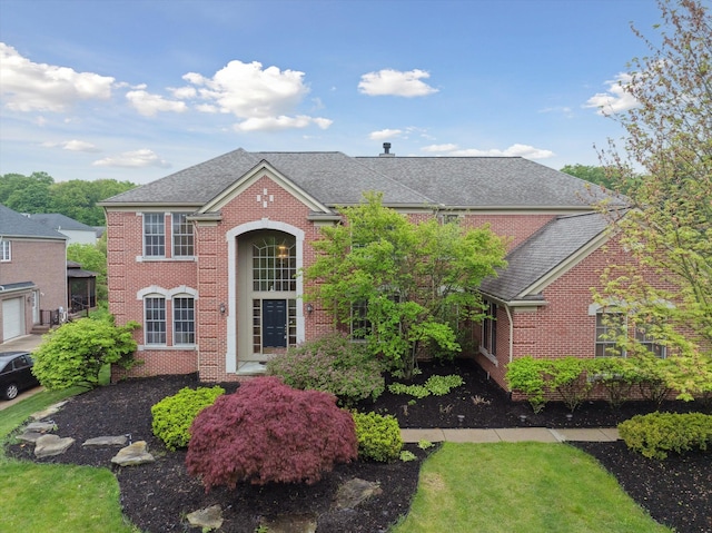 45055 Walnut Rdg, Northville, MI 48168 - colonial inspired home with brick siding and a shingled roof