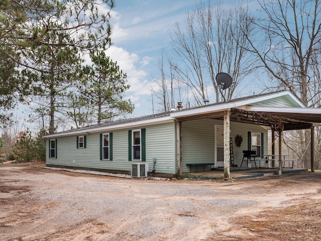 exterior space with central AC and driveway