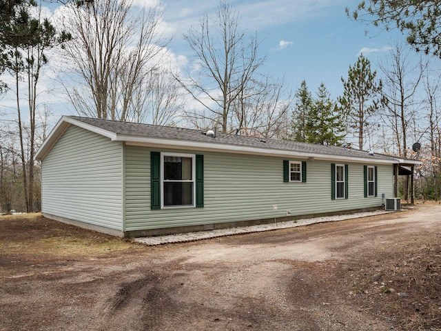 view of home's exterior with central AC