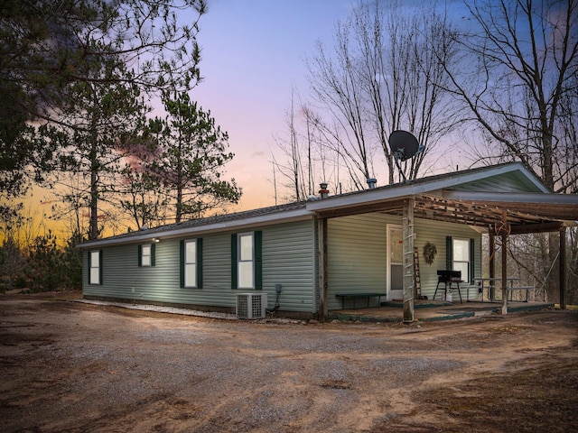 view of front facade featuring central air condition unit and covered porch