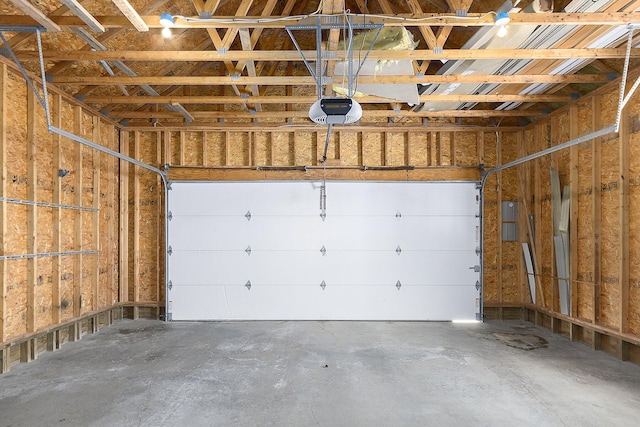 garage with electric panel and a garage door opener
