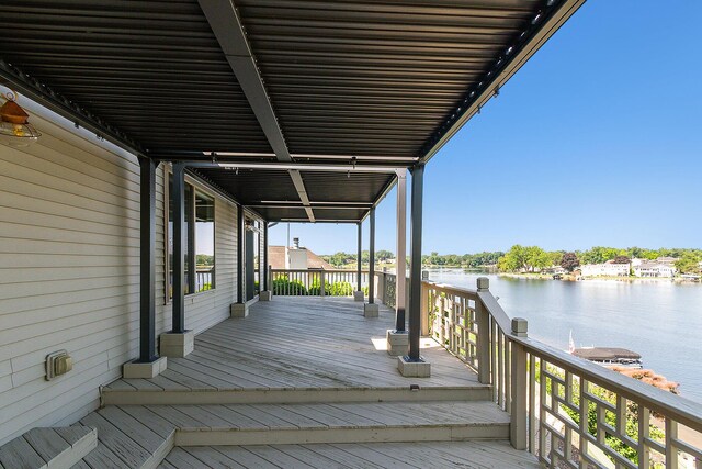 wooden deck featuring a water view