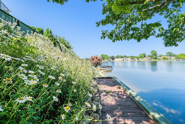 dock area featuring a water view