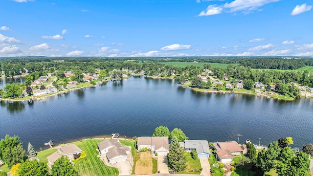 birds eye view of property with a water view and a residential view