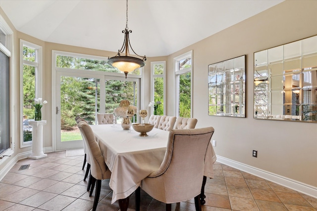 dining room with baseboards, vaulted ceiling, light tile patterned floors, and visible vents