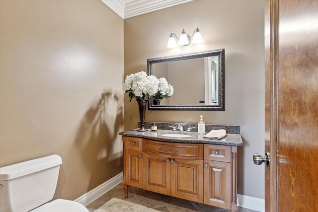 half bath with crown molding, tile patterned flooring, baseboards, vanity, and toilet