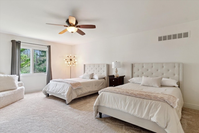 bedroom featuring visible vents, carpet, ceiling fan, and baseboards