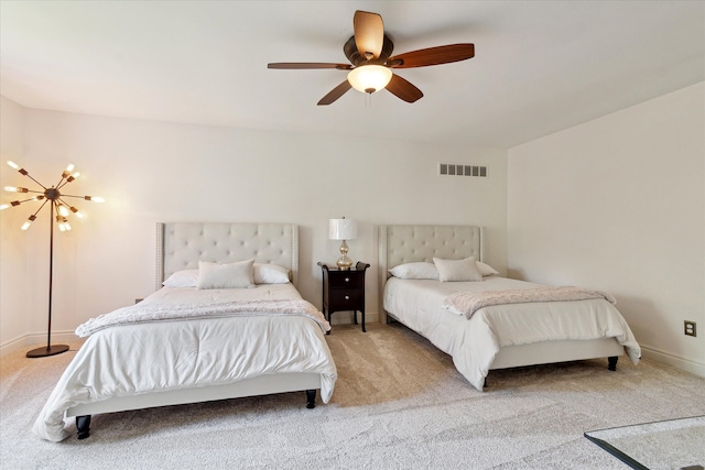 bedroom with baseboards, light carpet, ceiling fan with notable chandelier, and visible vents