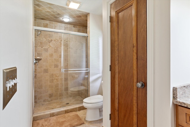 full bath with tile patterned floors, a stall shower, and toilet