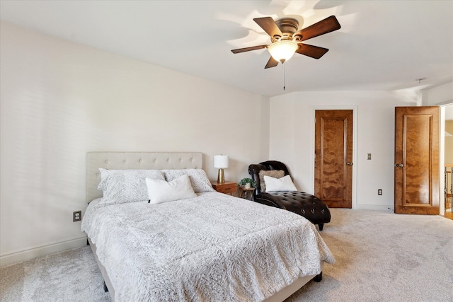 bedroom with baseboards, ceiling fan, and carpet