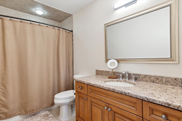 bathroom with vanity, tile patterned flooring, toilet, and curtained shower