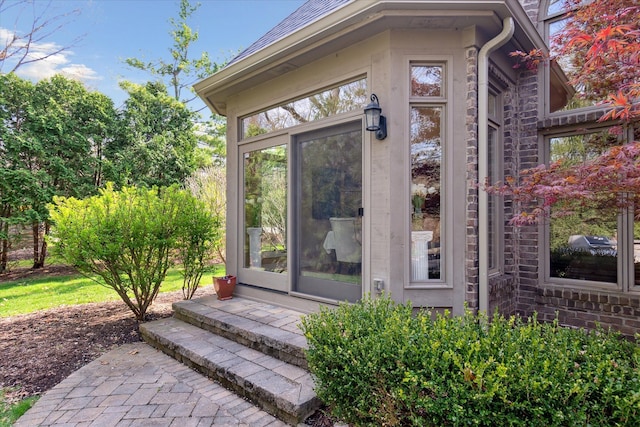 doorway to property featuring stone siding