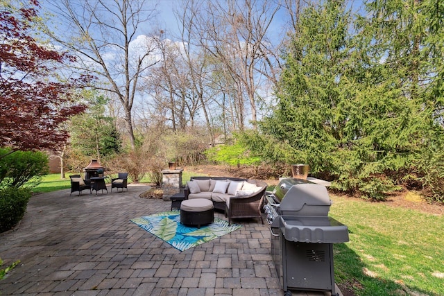 view of patio with an outdoor living space and grilling area
