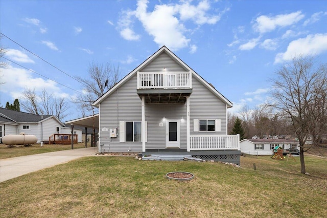 14319 Park Dr, Mecosta, MI 49332 - traditional home with driveway, a front lawn, a carport, and a deck
