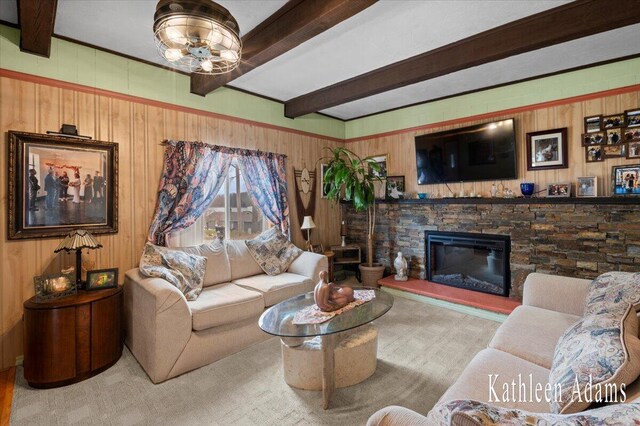 14319 Park Dr, Mecosta, MI 49332 - carpeted living area featuring beam ceiling, a fireplace, wood walls, and a chandelier