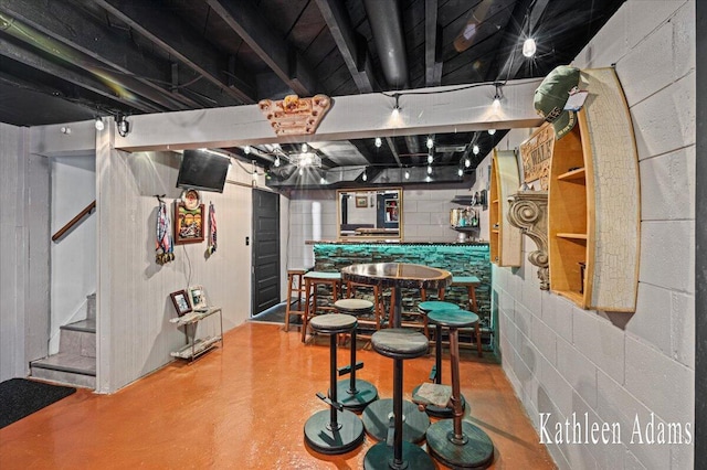 14319 Park Dr, Mecosta, MI 49332 - indoor bar featuring stairway and finished concrete flooring