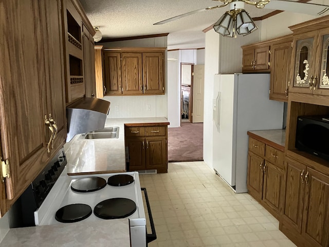 4539 Williams Dr, Silverwood, MI 48760 - kitchen with light countertops, white appliances, a textured ceiling, glass insert cabinets, and light floors