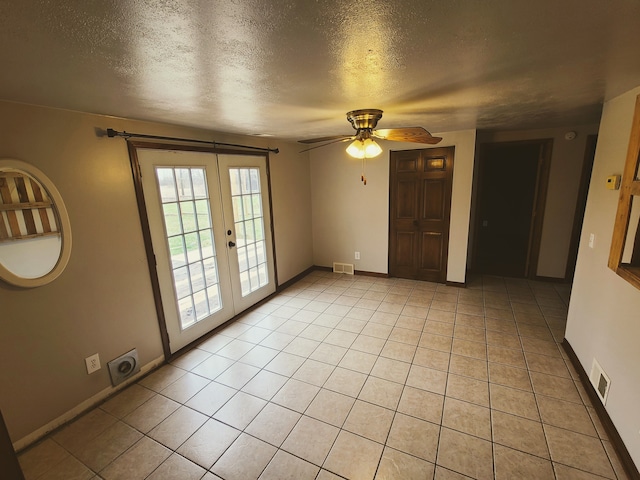 4161 Maple St, Brown City, MI 48416 - spare room featuring french doors, a textured ceiling, a ceiling fan, baseboards, and light tile patterned flooring