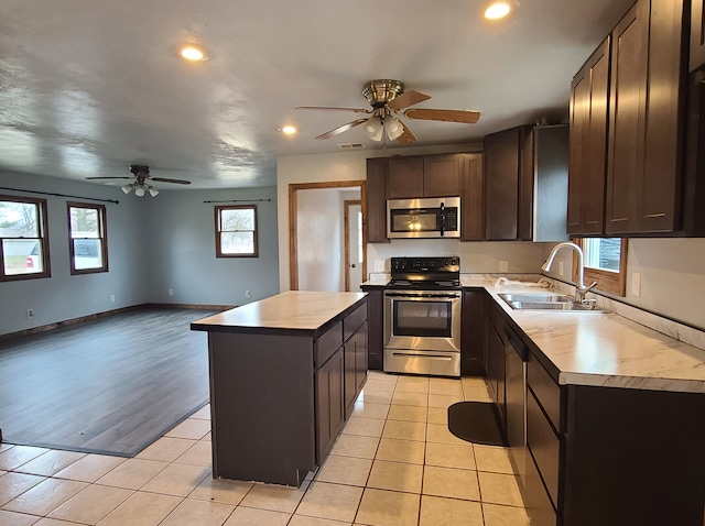 4161 Maple St, Brown City, MI 48416 - kitchen with appliances with stainless steel finishes, a ceiling fan, a sink, recessed lighting, and dark brown cabinetry