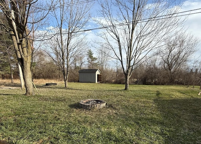4161 Maple St, Brown City, MI 48416 - view of grassy yard featuring a fire pit