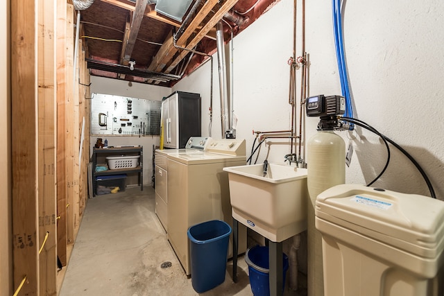 laundry room with independent washer and dryer and laundry area