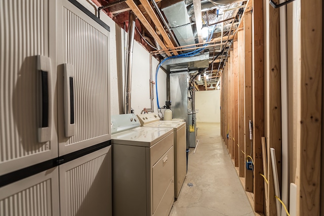 unfinished basement featuring independent washer and dryer