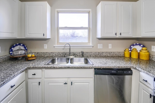 kitchen with a sink, white cabinetry, and dishwasher