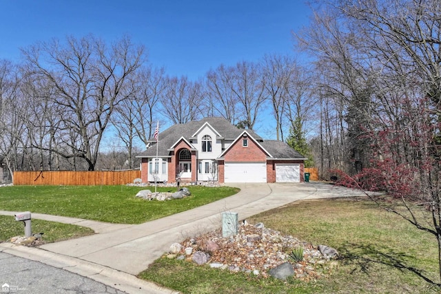 501 Dutch Mill Dr, Flushing, MI 48433 - view of front of property with brick siding and concrete driveway