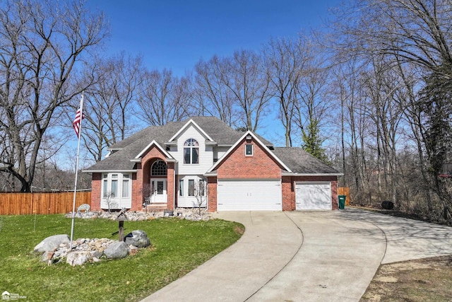 501 Dutch Mill Dr, Flushing, MI 48433 - view of front of home featuring brick siding, concrete driveway, a garage, and roof with shingles