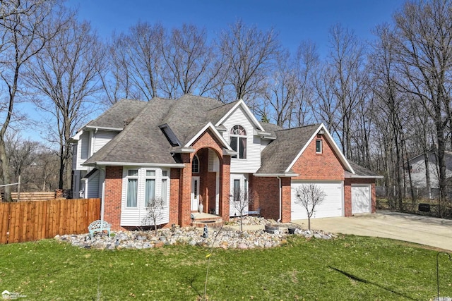 501 Dutch Mill Dr, Flushing, MI 48433 - view of front of home with brick siding, concrete driveway, a garage, and a shingled roof