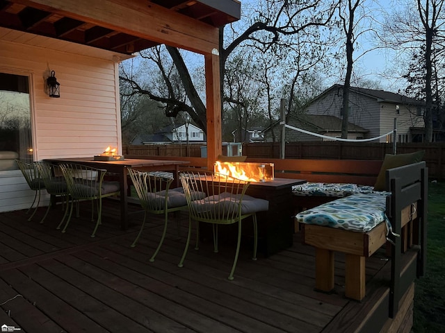 501 Dutch Mill Dr, Flushing, MI 48433 - wooden deck with a fire pit and fence