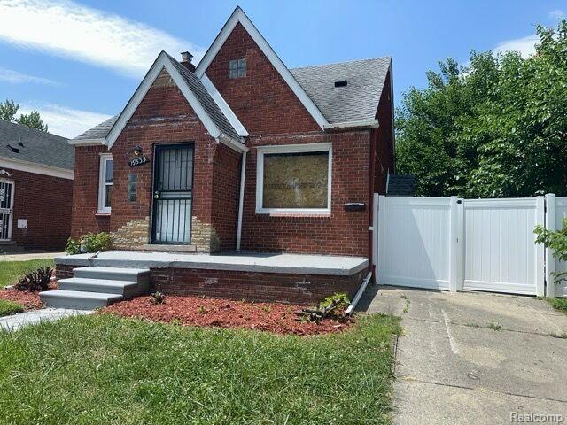 19533 Barlow St, Detroit, MI 48205 - tudor-style house with brick siding and a shingled roof