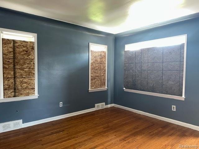 19533 Barlow St, Detroit, MI 48205 - empty room with dark wood finished floors