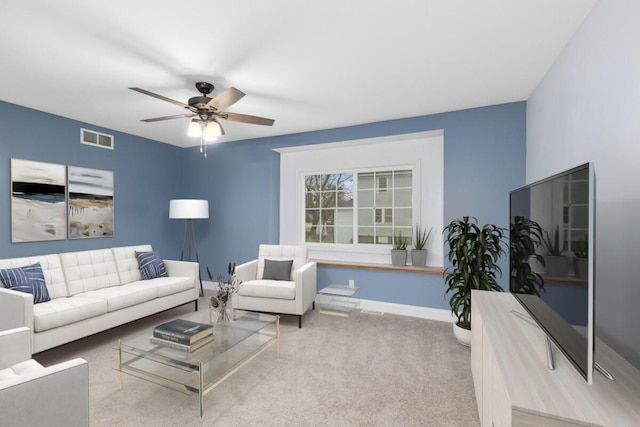 2206 Woodward Ave, Kalamazoo, MI 49007 - living room with baseboards, visible vents, carpet flooring, and a ceiling fan