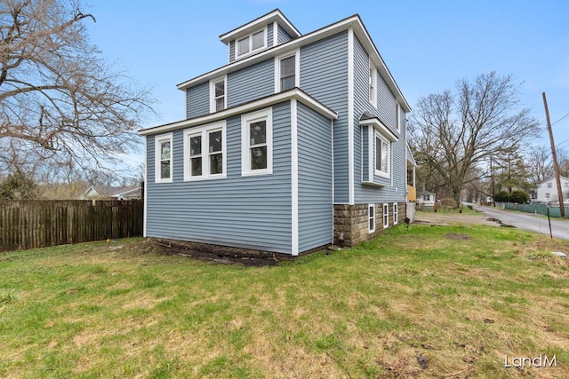 2206 Woodward Ave, Kalamazoo, MI 49007 - view of property exterior with fence and a lawn