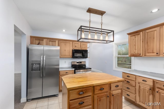 2206 Woodward Ave, Kalamazoo, MI 49007 - kitchen featuring butcher block countertops, stainless steel appliances, recessed lighting, hanging light fixtures, and light tile patterned floors