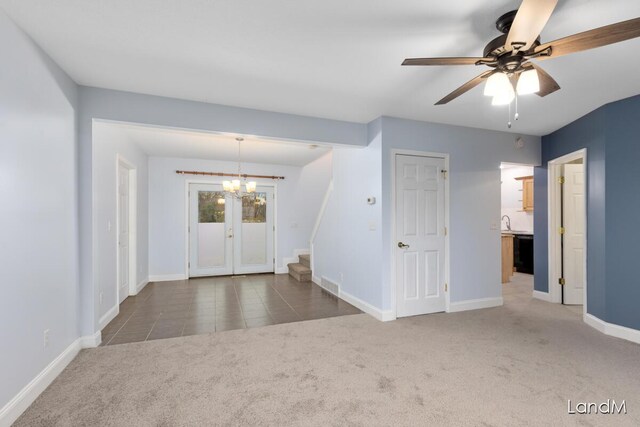 2206 Woodward Ave, Kalamazoo, MI 49007 - interior space featuring stairs, ceiling fan with notable chandelier, carpet, baseboards, and visible vents
