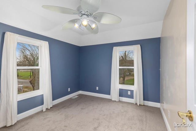 2206 Woodward Ave, Kalamazoo, MI 49007 - spare room featuring baseboards, carpet floors, lofted ceiling, and ceiling fan