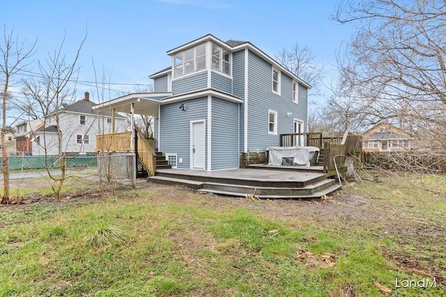 2206 Woodward Ave, Kalamazoo, MI 49007 - back of house with fence and a wooden deck