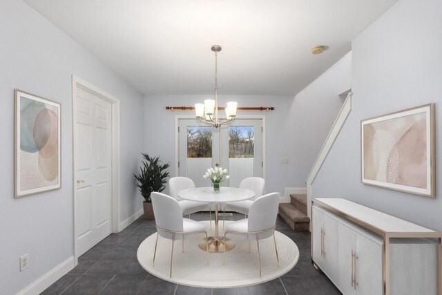 2206 Woodward Ave, Kalamazoo, MI 49007 - dining room with baseboards, a notable chandelier, and stairway