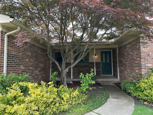 17018 White Haven Dr, Northville, MI 48168 - entrance to property with brick siding